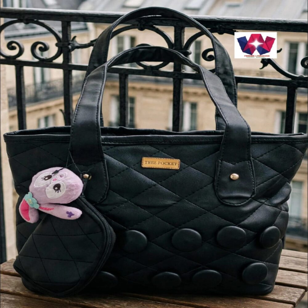 Black Quilted Tote Handbag with Front Pouch and Decorative Plush Charm